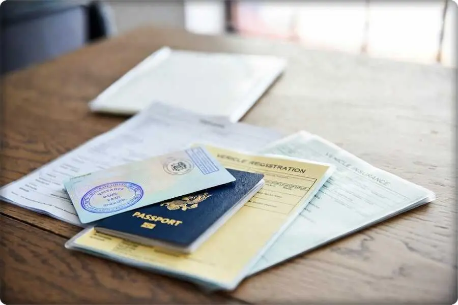 Perfect Planning for a Road Trip and Long Drives 3 A folder with passports and vehicle documents representing the logistics of a road trip planning and gear strategy.