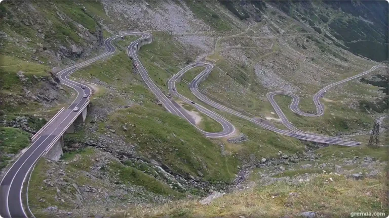 Scenic road trip Europe: Transfăgărășan Highway switchbacks rising through Carpathian Mountains, Romania.